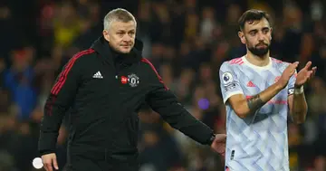 Solskjaer interacts with Bruno Fernandes following Man United's match at Vicarage Road on November 20, 2021 in Watford, England. (Photo by Charlie Crowhurst/Getty Images)