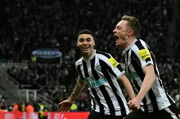 Newcastle midfielder Sean Longstaff (R) celebrates after scoring against Southampton
