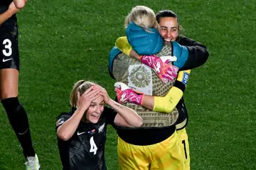 New Zealand defender Catherine Bott (L) celebrates victory over Norway