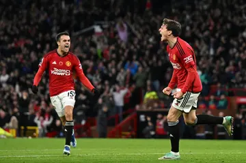 Manchester United's Victor Lindelof (R) celebrates scoring against Luton