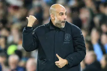 Manchester City manager Pep Guardiola reacts to Erling Haaland's second goal
