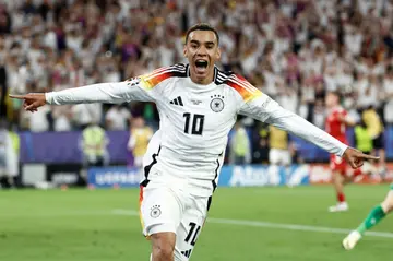 Jamal Musiala celebrates scoring Germany's second goal against Denmark