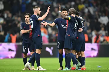 Paris Saint-Germain players celebrate after beating Marseille 2-0 in Ligue 1 on Sunday