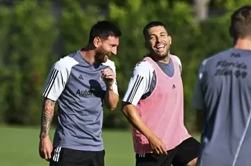 Inter Miami's new Spanish defender Jordi Alba jokes with Lionel Messi during training ahead of Wednesday's Leagues Cup match against Orlando City