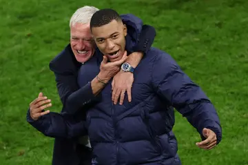 France coach Didier Deschamps and forward Kylian Mbappe after the quarter-final win over Portugal