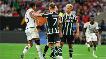 Manchester United midfielder Mason Mount shoves Real Madrid's Jude Bellingham during a first-half skirmish during the Soccer Champions Tour match at NRG Stadium. Photo by Ken Murray.