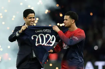 Warren Zaire-Emery poses alongside PSG president Nasser al-Khelaifi on Saturday after agreeing a new contract with the French champions