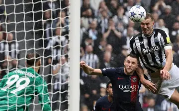 Dan Burn (right) scored Newcastle's second goal in victory over PSG