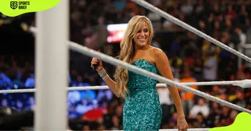 Ring announcer Lilian Garcia enters the ring.