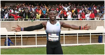 Ferdinand Omanyala celebrates with spectators after winning the men's 100m event during the Kip Keino Classic at the Kasarani stadium. Photo by SIMON MAINA.