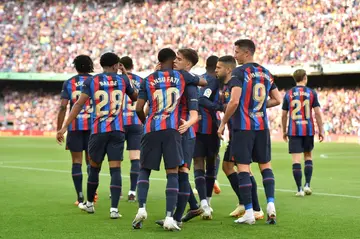 Barcelona's Spanish forward Ansu Fati (C) celebrates with teammates after scoring his team's first goal in the last game at Camp Nou