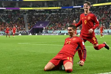 Spain forward Ferran Torres celebrates with teammates after scoring his team's fourth goal against Costa Rica