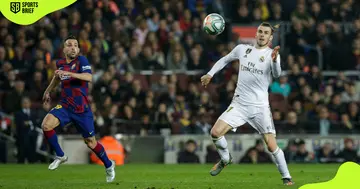 Real Madrid's Gareth Bale and Jordi Alba of Barcelona in action.