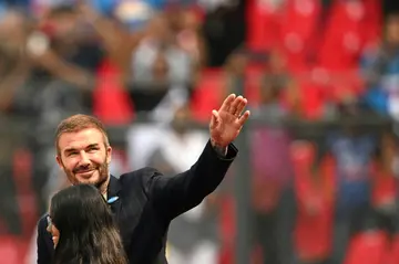 David Beckham waves to fans before the Cricket World Cup semi-final between India and New Zealand