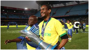 Mamelodi Sundowns boss, Rulani Mokwena, holding the DSTV Premiership trophy at Loftus Versfeld Stadium on Saturday, May 25, 2024. Photo: iDiski Times.