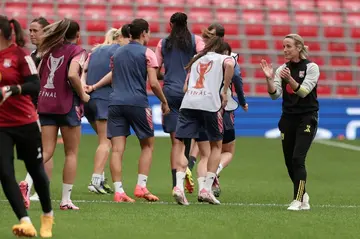 Lyon's French coach Sonia Bompastor (R) heads a training session on the eve of the Women's Champions League final