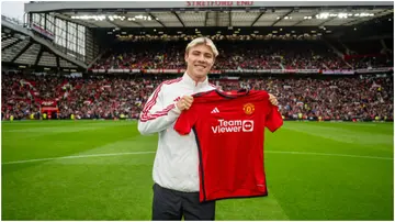 Rasmus Hojlund walks out to greet the fans ahead of the pre-season friendly match between Manchester United and RC Lens at Old Trafford. Photo by Ash Donelon.