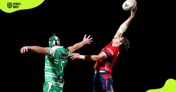 Tasman's Ethan Blackadder (in red) wins a lineout.