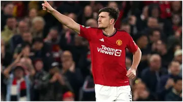 Harry Maguire celebrates after scoring during the Premier League match between Man United and Sheffield at Old Trafford. Photo by Martin Rickett.