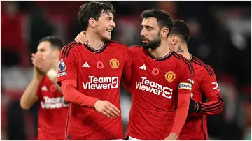 Victor Lindelof congratulated by Bruno Fernandes at the end of the Premier League match between Manchester United and Luton Town at Old Trafford. Photo by Oli Scarff. 