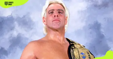 Ric Flair poses with the World Heavyweight Champion belt. 