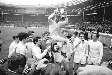 Leeds United captain Billy Bremner holds the League Cup as his teammates carry him on their shoulders on March 02 1968