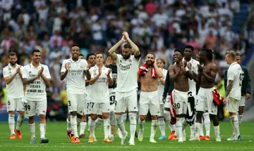 Karim Benzema (C) applauds surrounded by teammates at the end of his final game for Real Madrid before Saudi switch