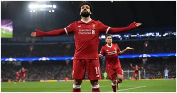 Mohamed Salah celebrates after scoring his side's first goal during the UEFA Champions League Quarter Final match between Man City and Liverpool. Photo by Laurence Griffiths.
