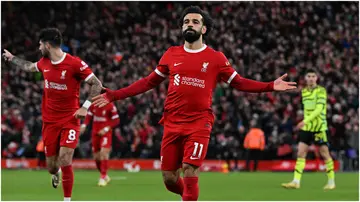 Mohamed Salah celebrates after scoring during the Premier League match between Liverpool FC and Arsenal FC at Anfield. Photo by John Powell.