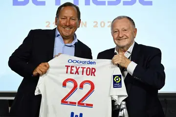US businessman John Textor (L) poses with Lyon president Jean-Michel Aulas