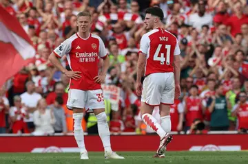 So close: Arsenal defender Oleksandr Zinchenko (C) and midfielder Declan Rice react after the win over Everton