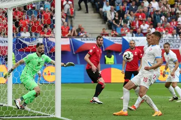 Czech Republic forward Patrik Schick (R) bundled home from close range to level against Georgia