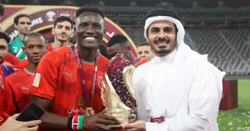 Kenya's Michael Olunga posing with the Amir Cup after helping Al Duhail lift the trophy. Photo: @OgadaOlunga.