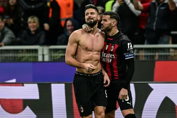 Olivier Giroud (C) netted late to earn AC Milan a late win over Spezia