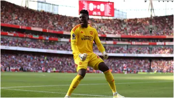 Andre Onana celebrates during the Premier League match between Arsenal FC and Manchester United at Emirates Stadium. Photo by Michael Steele.