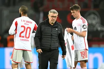 Urs Fischer (C) leaves the pitch after Union Berlin's defeat against Bayer Leverkusen on Sunday