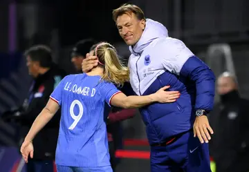 France's new coach Herve Renard congratulates Eugenie Le Sommer on her two goals