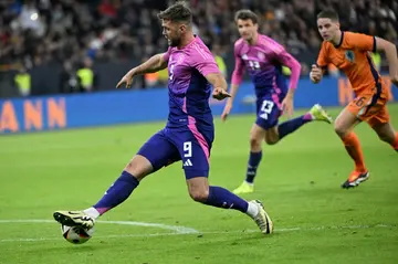 Match winner: Germany forward Niclas Fuellkrug runs with the ball