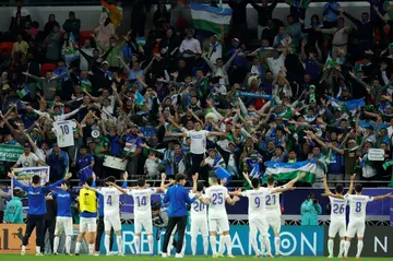 Uzbekistan's players salute their fans
