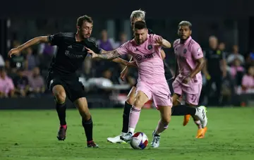 Inter Miami's Lionel Messi and Nashville defender Jack Maher vie for the ball during the teams' Major League Soccer scoreless draw