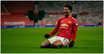 Marcus Rashford celebrates scoring a goal to make the score 1-0 during the Premier League match between Manchester United and Wolves. Photo by Ash Donelon.
