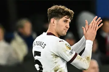 Manchester City's John Stones leaves the pitch with an injury against Everton