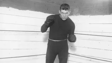 American heavyweight boxer Gene Tunney shadow boxing at a gym in Red Bank