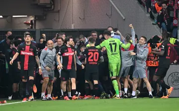 Leverkusen celebrates after defender Josip Stanisic scored in the seventh minute of injury time to..