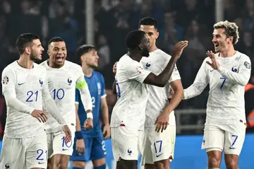 Youssouf Fofana (C) celebrates with his teammates after scoring France's equaliser in their 2-2 draw with Greece