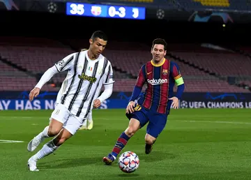 Messi and Ronaldo in action.