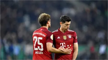 Bayern Munich stars Robert Lewandowski and Thomas Muller cut dejected faces after they crashed out of DFB-Pokal. Photo: Marius Becker.