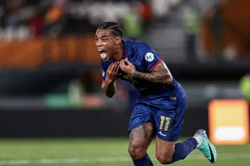 Garry Rodrigues wheels away in delight after securing a famous win for Cape Verde