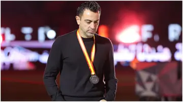 Xavi walks during the medal ceremony after the Spanish Super Cup final football match between Real Madrid and Barcelona. Photo by Giuseppe Cacace.
