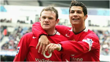 Wayne Rooney and Cristiano Ronaldo celebrate scoring the first goal during the Barclays Premier League match between Manchester City and Manchester United in 2005. Photo by Matthew Peters.